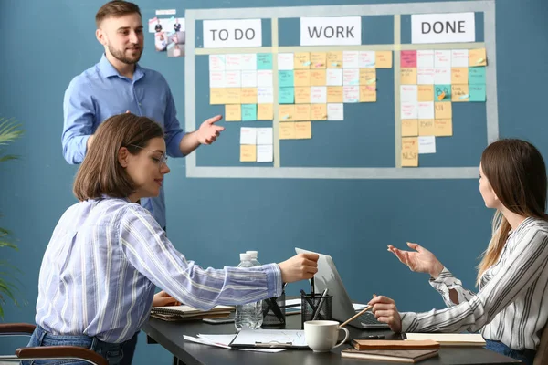 Young business people at meeting in office — Stock Photo, Image