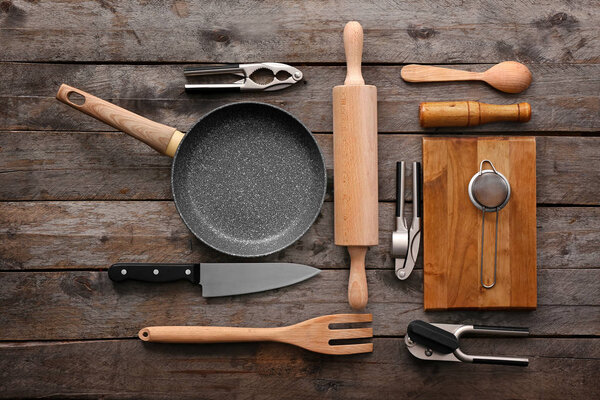 Set of kitchenware on wooden background