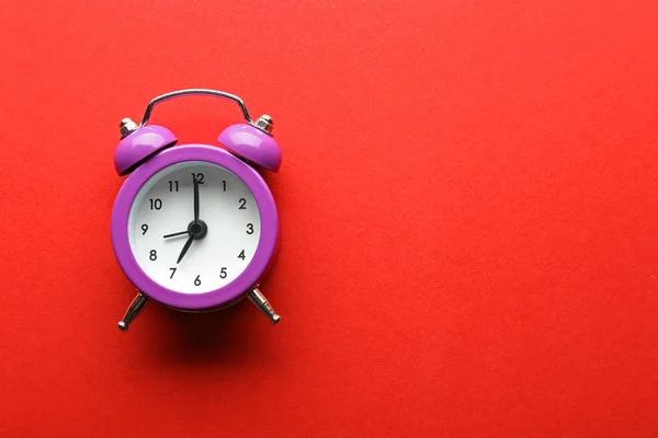 Alarm clock on color background — Stock Photo, Image