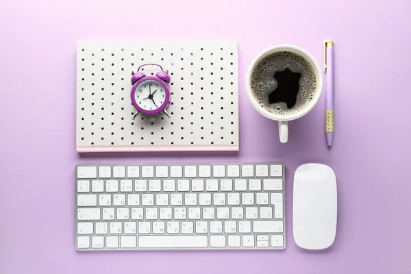 Computer keyboard, notebook, cup of coffee and alarm clock on color background — Stock Photo, Image