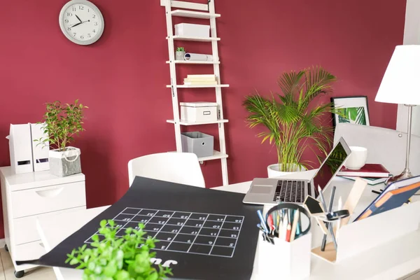 Stylish workplace with laptop and calendar in modern room — Stock Photo, Image