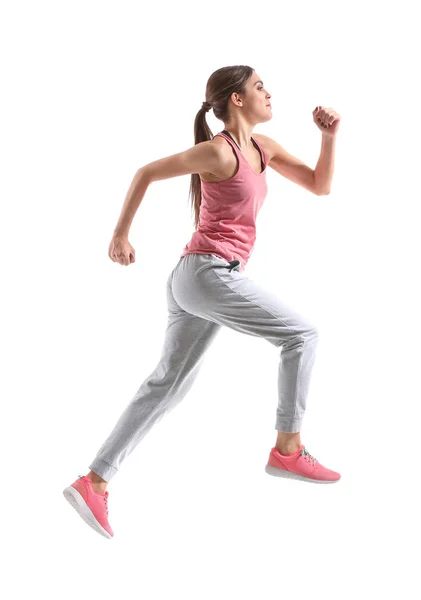 Deportiva joven corriendo contra fondo blanco — Foto de Stock