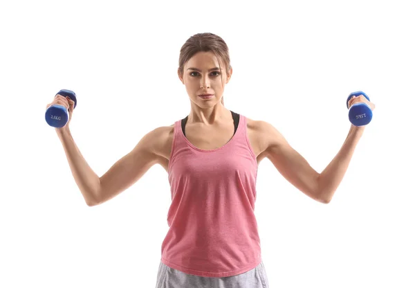 Sporty young woman with dumbbells on white background — Stock Photo, Image