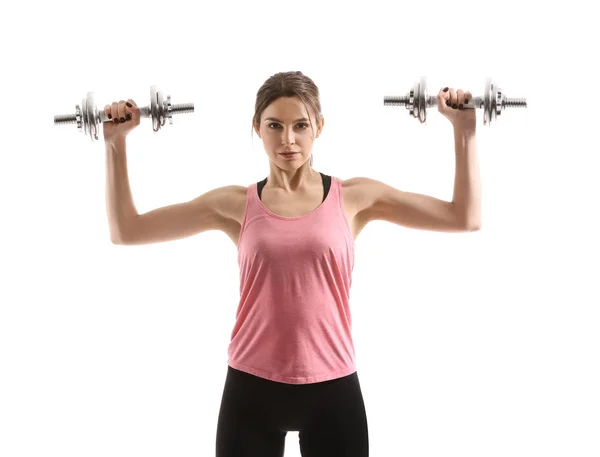 Sporty young woman with dumbbells on white background — Stock Photo, Image