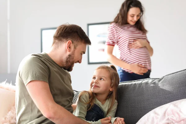 Happy family expecting baby resting at home — Stock Photo, Image