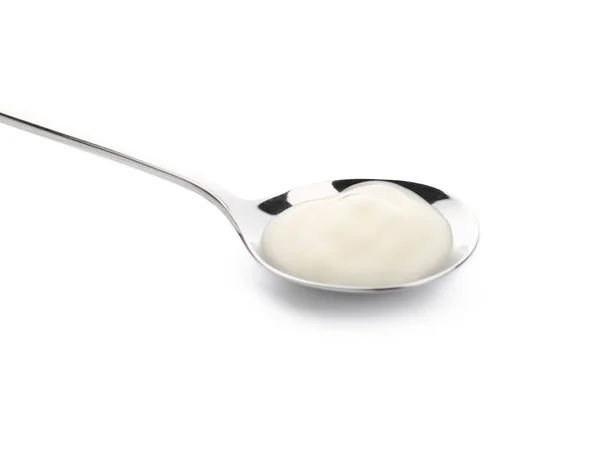 Spoon with tasty yogurt on white background — Stock Photo, Image
