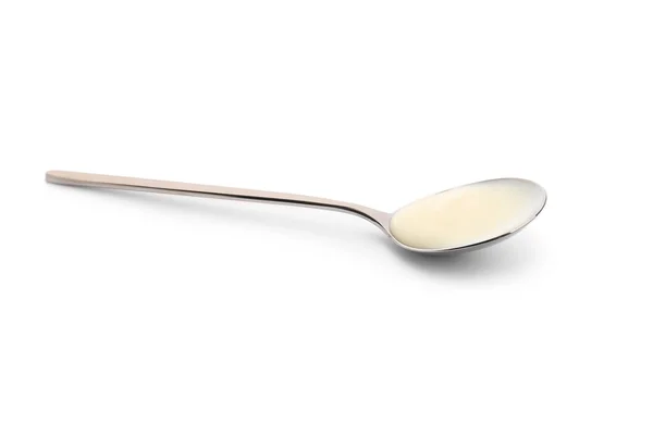 Spoon with tasty yogurt on white background — Stock Photo, Image