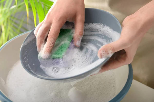 Woman washing dish in basin, closeup — Stock Photo, Image