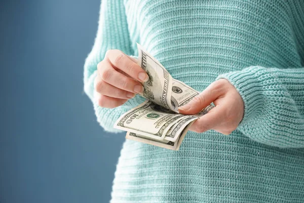 Woman with dollar banknotes, closeup