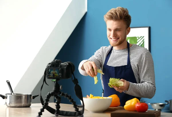 Young male food blogger recording video in kitchen — Stock Photo, Image