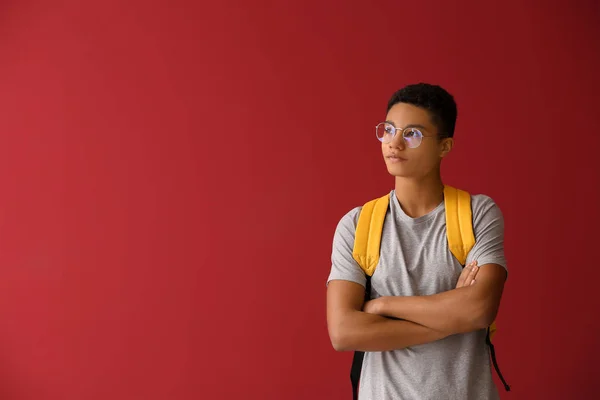 African-American schoolboy on color background — Stock Photo, Image