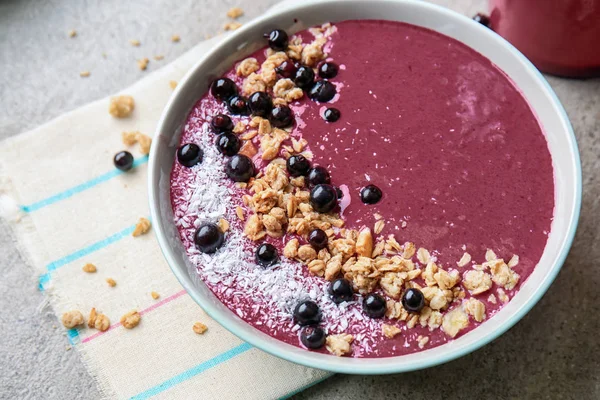 Bowl with tasty acai smoothie on table — Stock Photo, Image