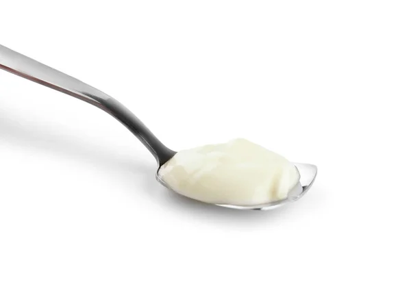 Spoon med välsmakande yoghurt på vit bakgrund — Stockfoto