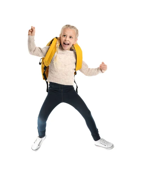 Jumping cute girl with backpack on white background — Stock Photo, Image