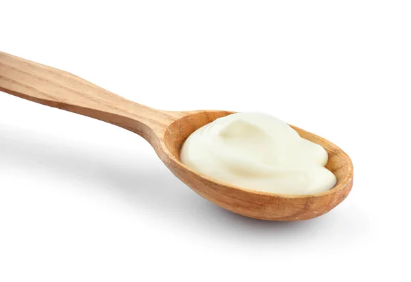 Spoon with tasty yogurt on white background — Stock Photo, Image