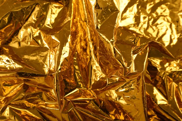 Golden foil as background — Stock Photo, Image