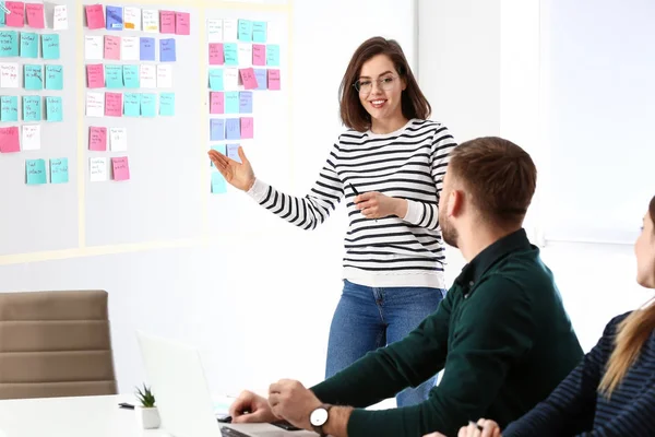 Young woman near scrum task board in office — Stock Photo, Image