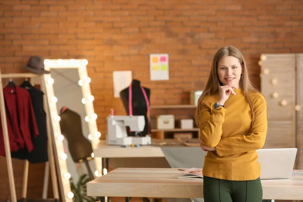 Portrait of beautiful female business owner in atelier — Stock Photo, Image