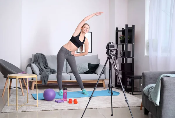 Young female blogger recording sports video at home — Stock Photo, Image