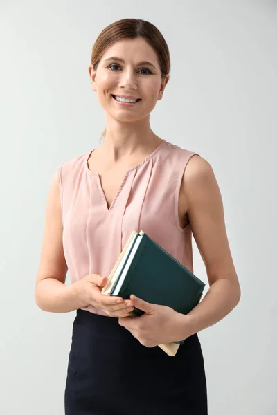 Beautiful businesswoman on light background — Stock Photo, Image
