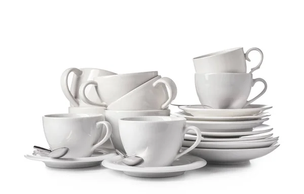 Set di piatti puliti su sfondo bianco — Foto Stock