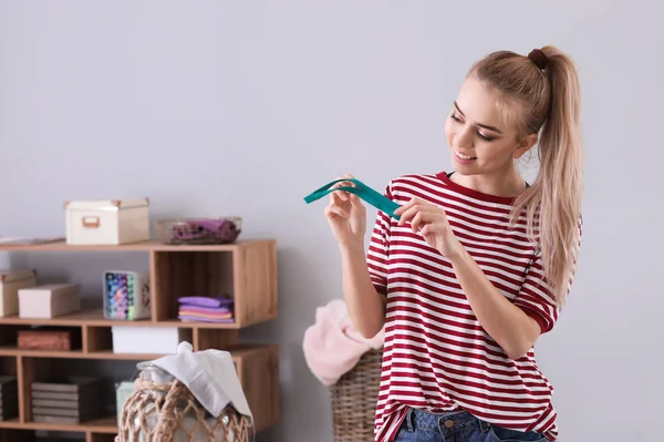 Young woman with zipper at home — Stock Photo, Image