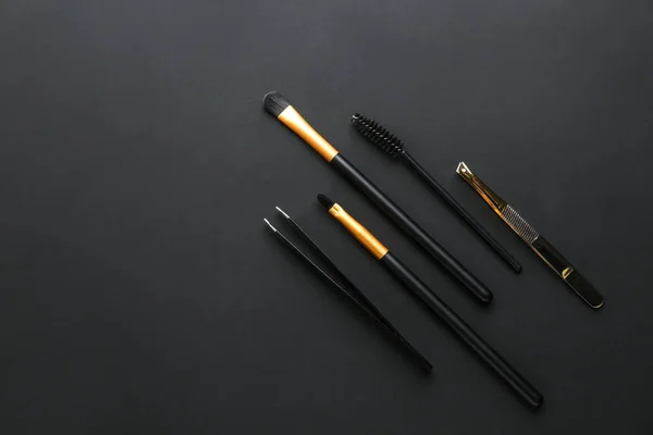 Set of tools for eyebrows correction on dark background — Stock Photo, Image