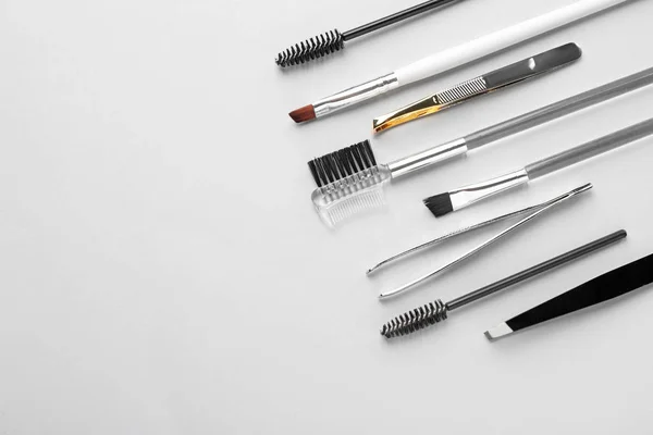 Set of tools for eyebrows correction on white background