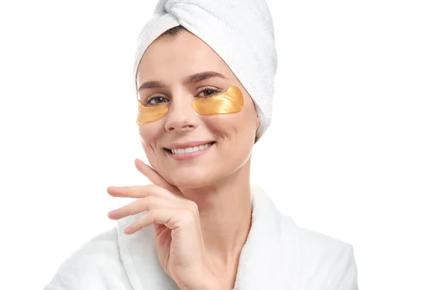 Woman with under-eye patches on white background — Stock Photo, Image