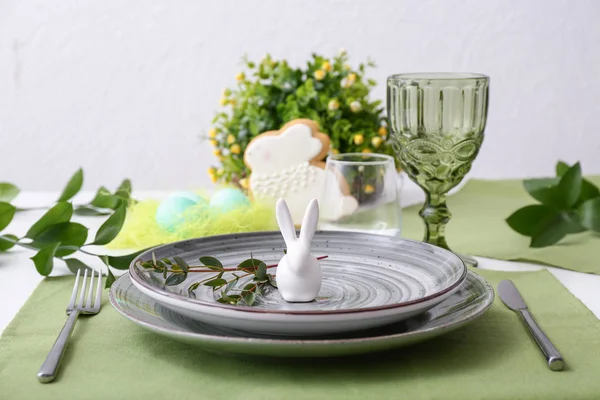 Beautiful Easter table setting with floral decor — Stock Photo, Image