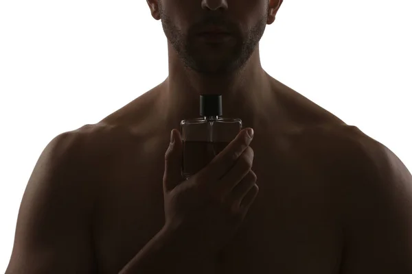 Silhouette av stilig man med flaska parfym på vit bakgrund, närbild — Stockfoto