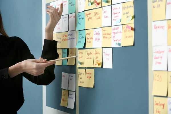 Young woman near scrum task board in office — Stock Photo, Image