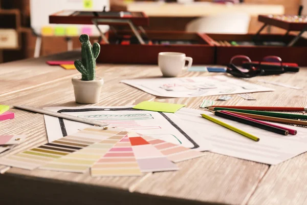 Color palette swatches on table of IT designer