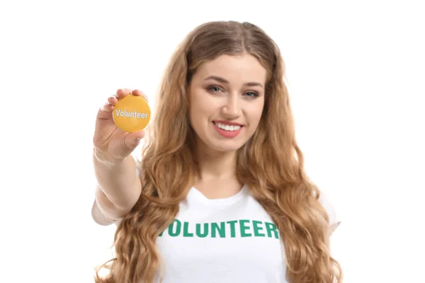 Młoda suczka wolontariuszy z odznaka na białym tle — Zdjęcie stockowe