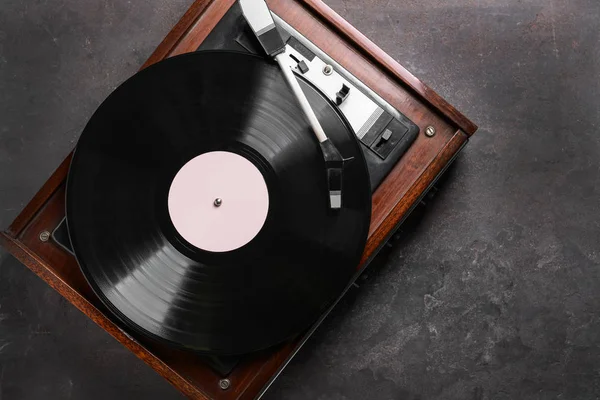 Record player with vinyl disc on grey background — Stock Photo, Image