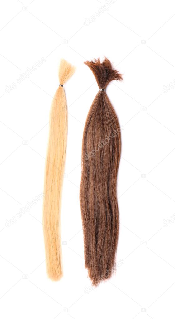 Hair strands on white background. Concept of donation