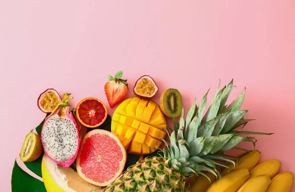 Assortment of exotic fruits on color background — Stock Photo, Image