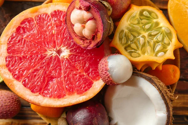 Assortment of tasty exotic fruits on table, closeup — Stock Photo, Image