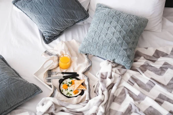 Tasty healthy breakfast on bed — Stock Photo, Image