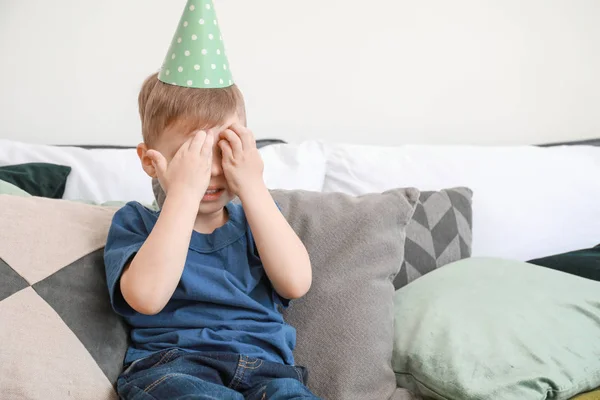 Sad little boy celebrating birthday at home — Stock Photo, Image