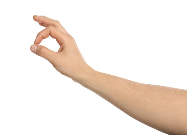 Männliche Hand hält etwas auf weißem Hintergrund — Stockfoto
