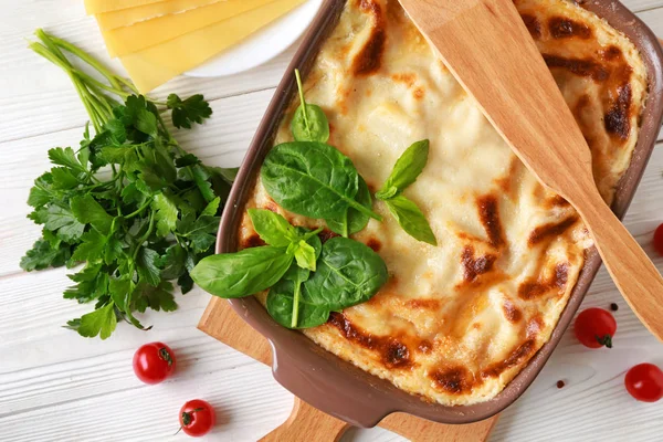 Tasty baked lasagna on white table — Stock Photo, Image