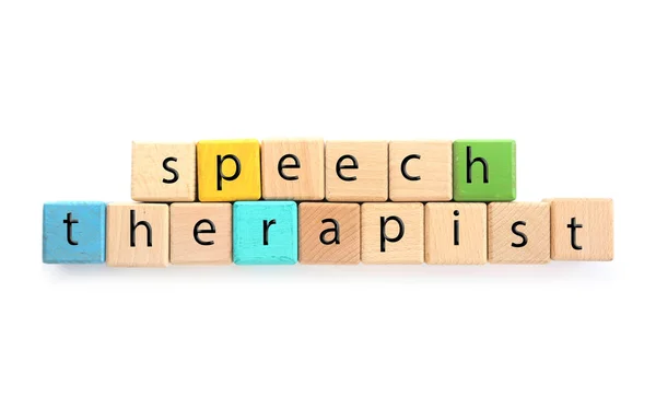 Cubes with text SPEECH THERAPIST on white background — Stock Photo, Image