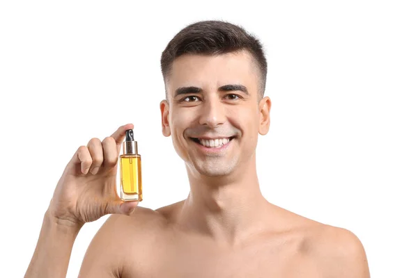 Stilig man med face serum på vit bakgrund — Stockfoto