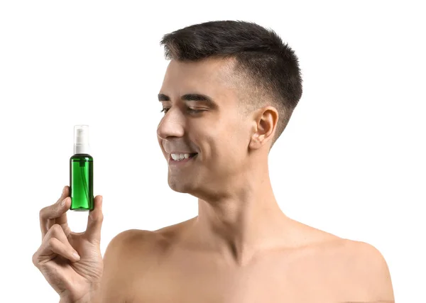 Handsome man with face serum on white background — Stock Photo, Image