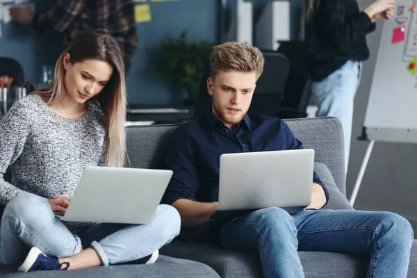 Young IT specialists working in modern office