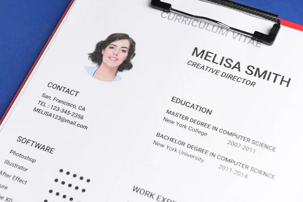 Job resume on color background, closeup