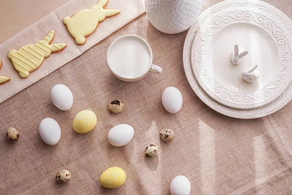 Tasty Easter cookies with milk and eggs on table — Stock Photo, Image