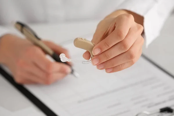 Female doctor with hearing aid, closeup — Stock Photo, Image