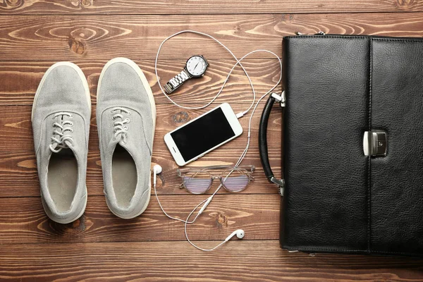 Set of male accessories with mobile phone on wooden background — Stock Photo, Image